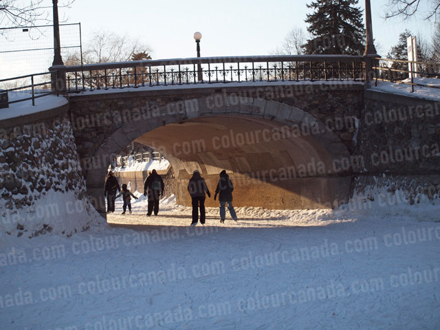 Skating Under a Stone Bridge | Cheap Stock Photo
