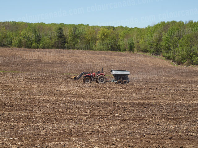 Farmer on a Tractor | Cheap High Resolution Stock Photo