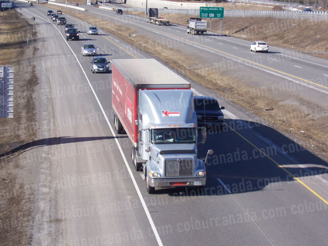 Transport Truck in Highway Traffic | Cheap Stock Photo