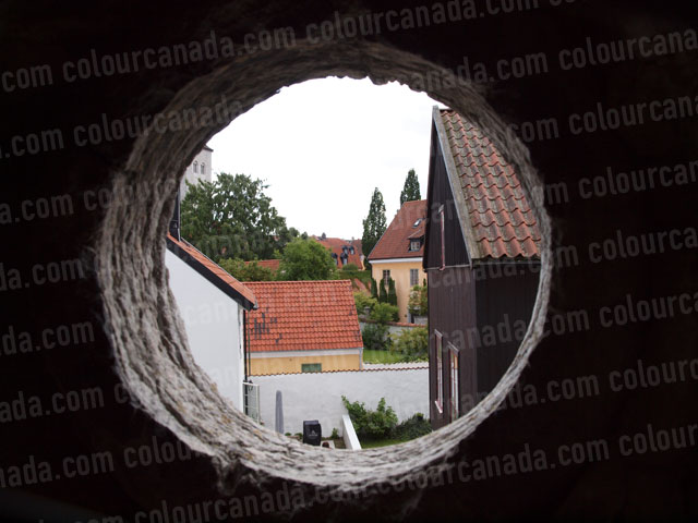 Visby, Sweden Through a Round Stone Window | Cheap Stock Photo